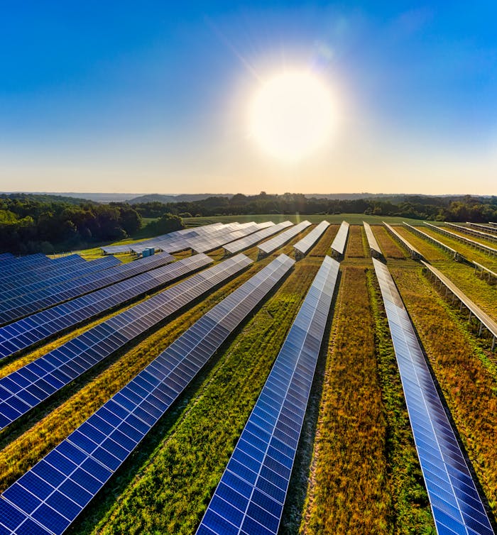 about-01 Aerial view of a solar farm in Red Wing, MN, with solar panels harnessing the sun's energy.